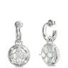 A pair of silver-toned huggie hoop earrings with circular drop charms featuring a floral quatrefoil design set with clear stones, shown from front and side angles on a white background.