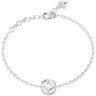 A delicate silver chain bracelet with a central round pavé-set clear gemstone and an adjustable lobster clasp, shown on a plain white background.