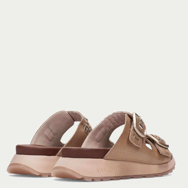 Pair of brown sandals on a light beige background