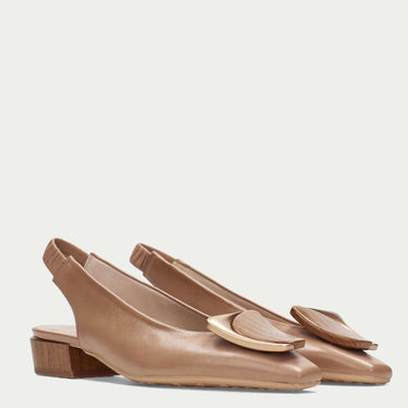 Pair of brown slingback shoes on a light gray background