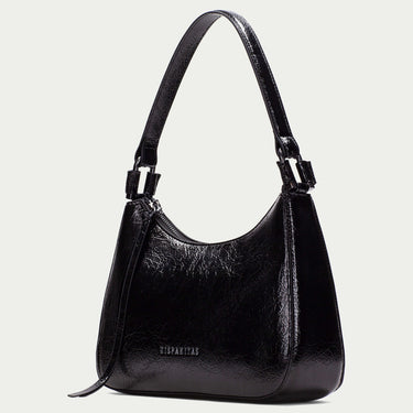 Black handbag on a light gray background