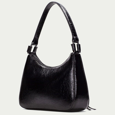 Black handbag on a light gray background