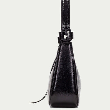 Black handbag on a light gray background