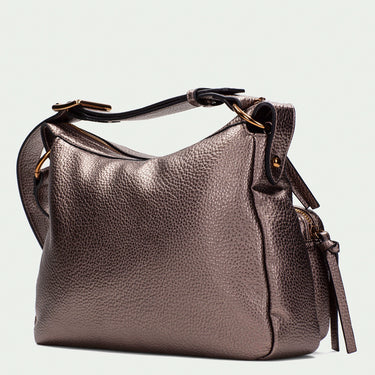 bronze leather handbag with a strap on a light beige background