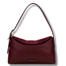 A burgundy leather shoulder bag with a matching adjustable strap and a small 'HISPANITAS' brand plaque on the front, shown against a plain white background.