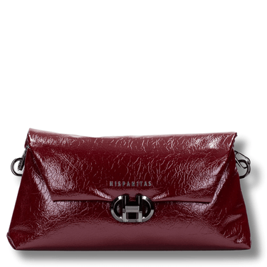 Red leather handbag with a silver clasp on a white background
