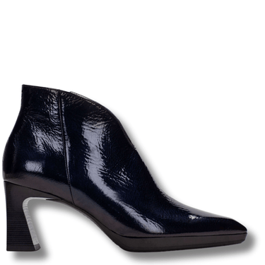 Navy patent leather ankle boot on a white background