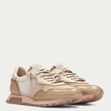 Beige sneakers on a light beige background