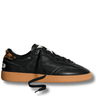 Black sneaker with brown sole on a white background