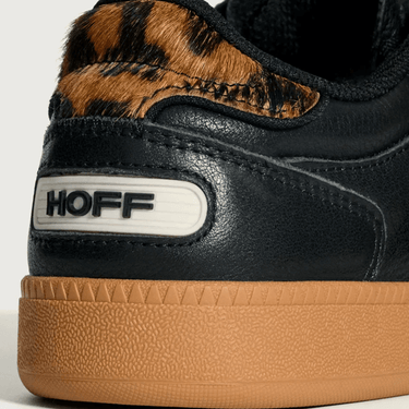 Black sneaker with leopard print accents and 'HOFF' branding on a light gray background