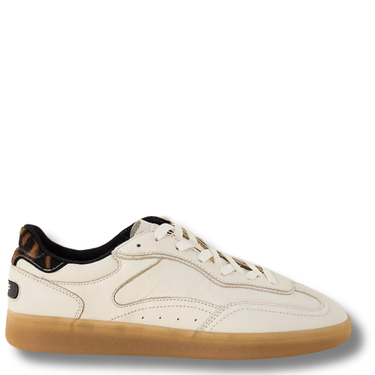 White sneaker with brown sole on a white background