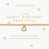 Gold bracelet with heart charm on a Joma Jewellery card