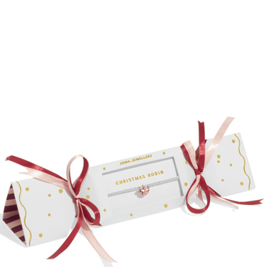 Decorative cracker with ribbons on a white background
