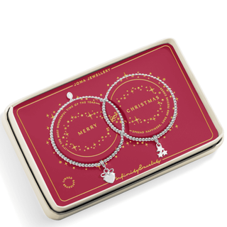 Two silver bracelets with charms on a red Joma Jewellery box.