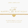 A gold beaded bracelet with a small heart-shaped pendant featuring a bow detail, presented on a white card with gold text celebrating a 30th birthday. The brand name 'JOMA JEWELLERY' is visible at the top.