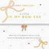 Joma Jewellery packaging with a bow bracelet and decorative bows on a white background