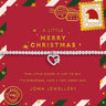 A Christmas-themed charm bracelet by Joma Jewellery, displayed on its red printed gift card. The bracelet itself is a delicate silver chain with a heart-shaped charm featuring a silver star and a small red heart.
