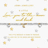 A silver beaded bracelet with a gold crescent moon charm and two small silver heart charms, displayed on a white Joma Jewellery gift card with gold lettering, surrounded by scattered gold and silver stars.