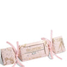 Three pink Christmas-themed gift boxes with gold foil designs and pink ribbons, including one box that reads 'MERRY CHRISTMAS FABULOUS FRIEND' and 'JOMA JEWELLERY'.