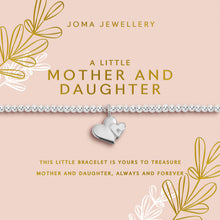 Joma Jewellery bracelet packaging with heart charm on a pink background