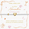 A silver beaded bracelet with a gold crescent moon and a gold heart charm engraved with 'Happy Birthday', presented on a white card with gold and pink November-themed illustrations and text from Joma Jewellery.