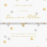 Joma Jewellery bracelet with star design on a white card with gold and silver stars.
