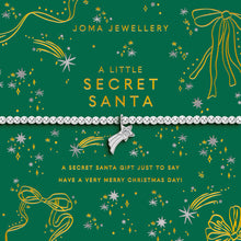Joma Jewellery Christmas-themed gift card with a silver beaded bracelet across the center, featuring gold and silver holiday illustrations on a dark green background.