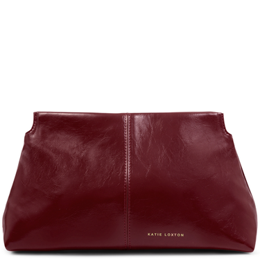 Red leather clutch bag with 'Katie Loxton' branding on a white background