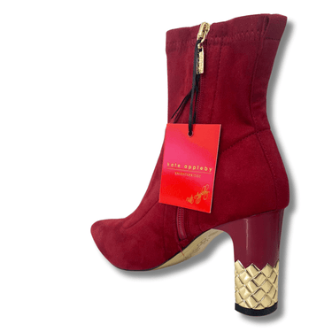 red ladies boots with decorative gold heel