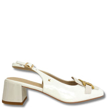 White sandal with gold accents on a white background