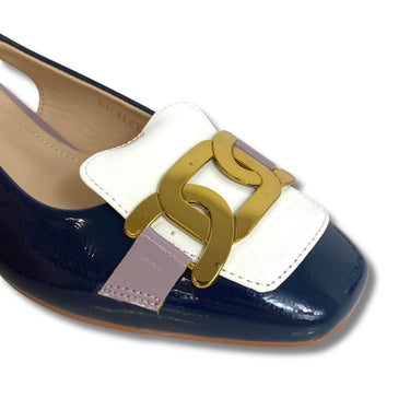 Navy and white shoe with gold buckle on a white background