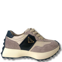 Suede sneaker with beige and black accents on a white background