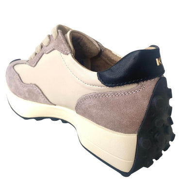 Suede shoe with beige, brown, and black color scheme on a white background