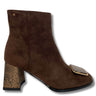 A brown suede ankle boot with a snakeskin-patterned block heel and a matching snakeskin accent on the square toe, shown against a plain white background.