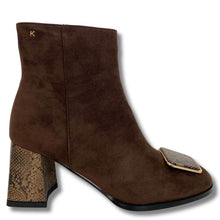 A brown suede ankle boot with a snakeskin-patterned block heel and a matching snakeskin accent on the square toe, shown against a plain white background.