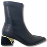 Black ankle boot with gold heel on a white background