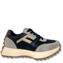 A low-top sneaker with navy blue leather panels, light gray suede overlays, a beige side logo, and a thick cream-colored midsole with a brown lug outsole, shown against a plain white background.