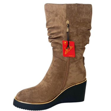 Brown wedge boot with a red tag on a white background