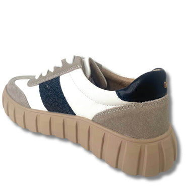 Sneaker with beige, white, and navy design on a white background