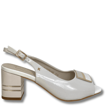 White high-heeled shoe with gold accents on a white background