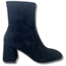 black ankle boot with rhinestone embellishments on a white background