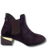 A dark purple suede ankle boot with a gold metallic block heel and a dark brown elastic side panel, shown from a side profile on a white background.
