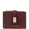 A small Katie Loxton zip-around card holder in burgundy leather with a gold-tone turn-lock closure and gold logo lettering on a white background.