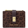 A Katie Loxton zip-around wallet in brown leopard print with a dark brown leather strap and gold-tone hardware, shown on a plain white background.