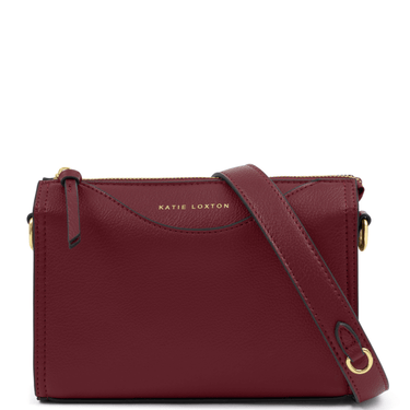 Red crossbody bag with a visible brand name on a white background