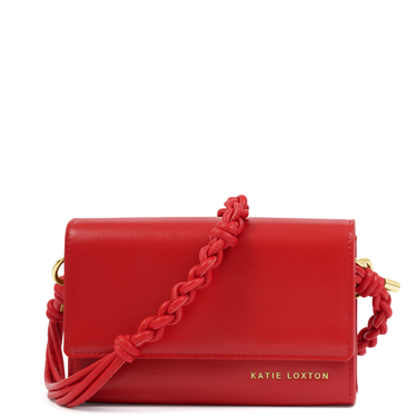Red handbag with braided strap on a white background, featuring the brand 'Katie Loxton'.