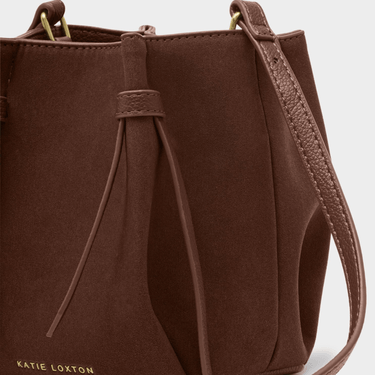 Brown handbag with drawstring detail on a white background