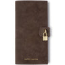 A dark brown leather wallet with a strap closure and a small gold padlock detail, featuring the brand name 'KATIE LOXTON' in gold lettering at the bottom.