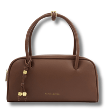 Brown handbag with gold accents on a white background