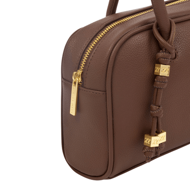 Brown handbag with gold accents on a white background